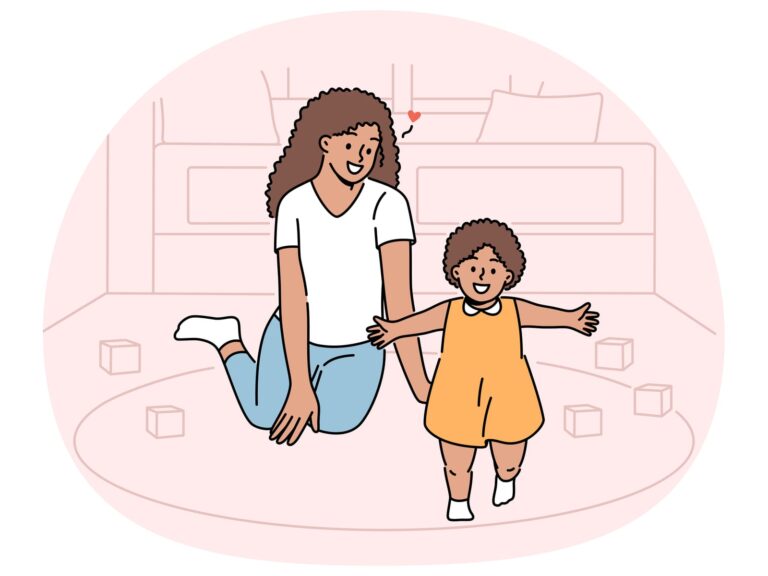An adult kneels on the floor, smiling warmly, while holding hands with a dependent toddler in an orange dress. Blocks are scattered around them.