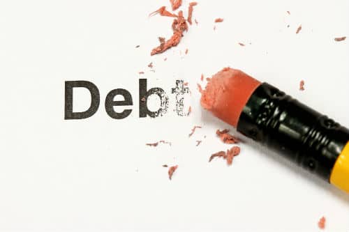 in debt