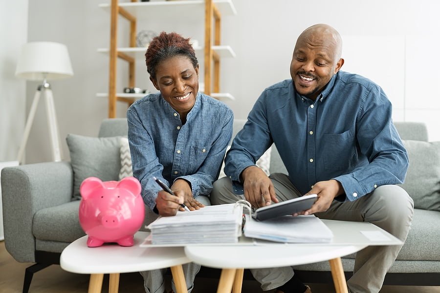 Happy African Couple Doing Retire Finances Plan And Money Budget