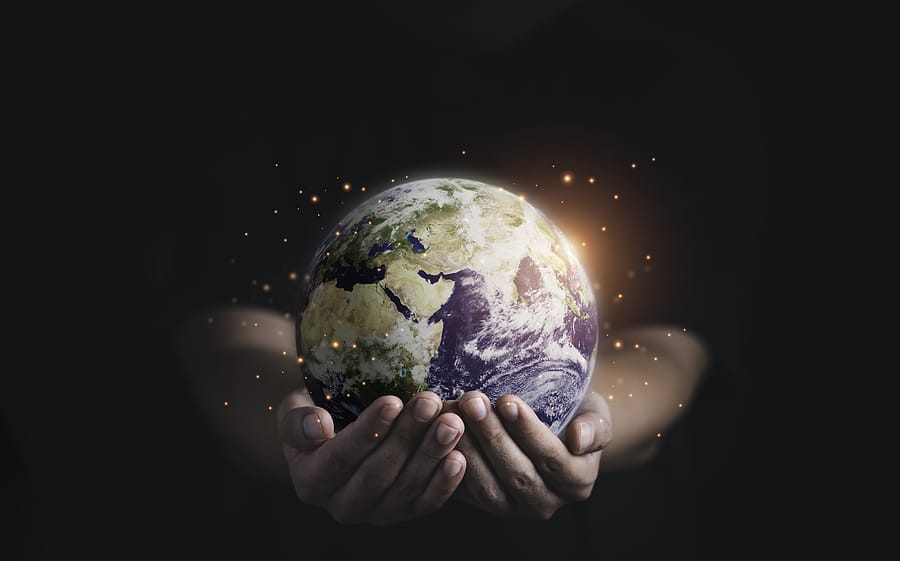 Man holding planet by two hands for earth day and saving energy environment concept ,Element of this image from NASA and 3d render.