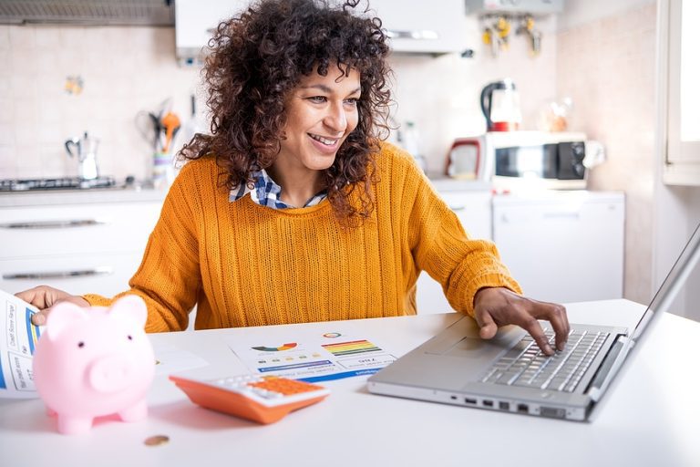 Cheerful black woman holding good credit score bank statement