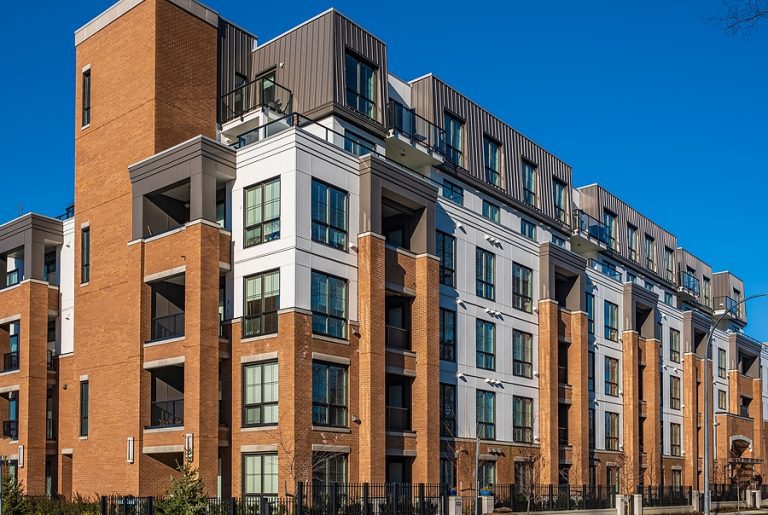 Modern apartment buildings on a sunny day with a blue sky. Facade of a modern apartment building. New apartment building