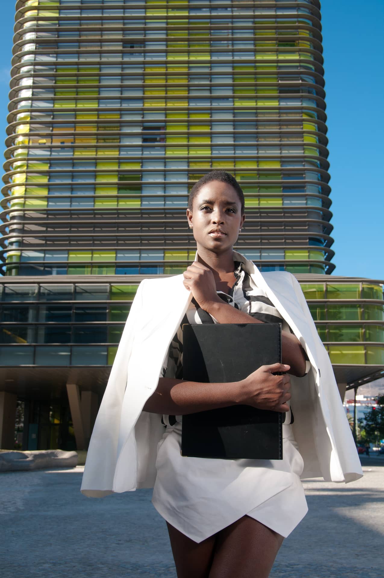 black business woman in front of building