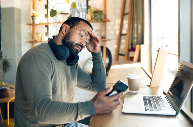 man stressed over student loan debt