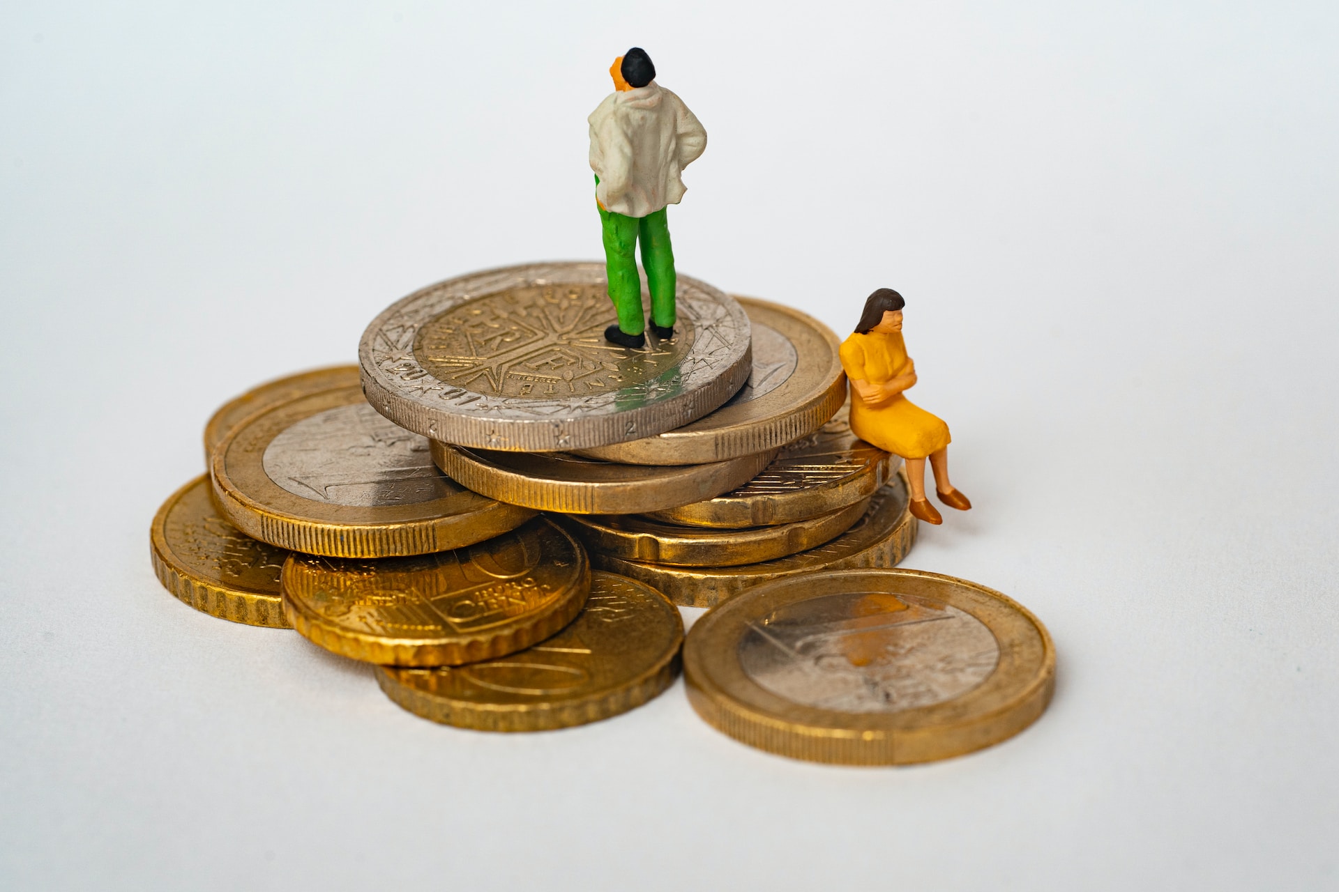 A couple standing on top of coins