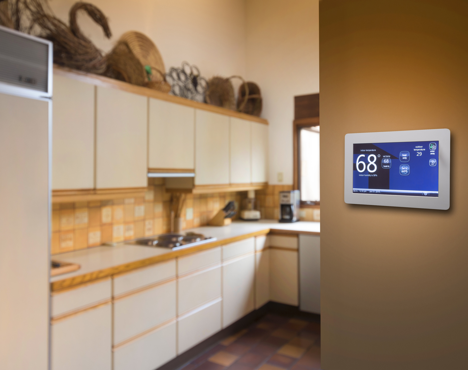 n energy-efficient kitchen featuring a programmable electronic thermostat set at 68 degrees, demonstrating practical energy efficiency tips for reducing heating costs.