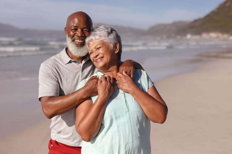 45060848_happy-senior-african-american-couple-embracing-each-other-on-the-beach